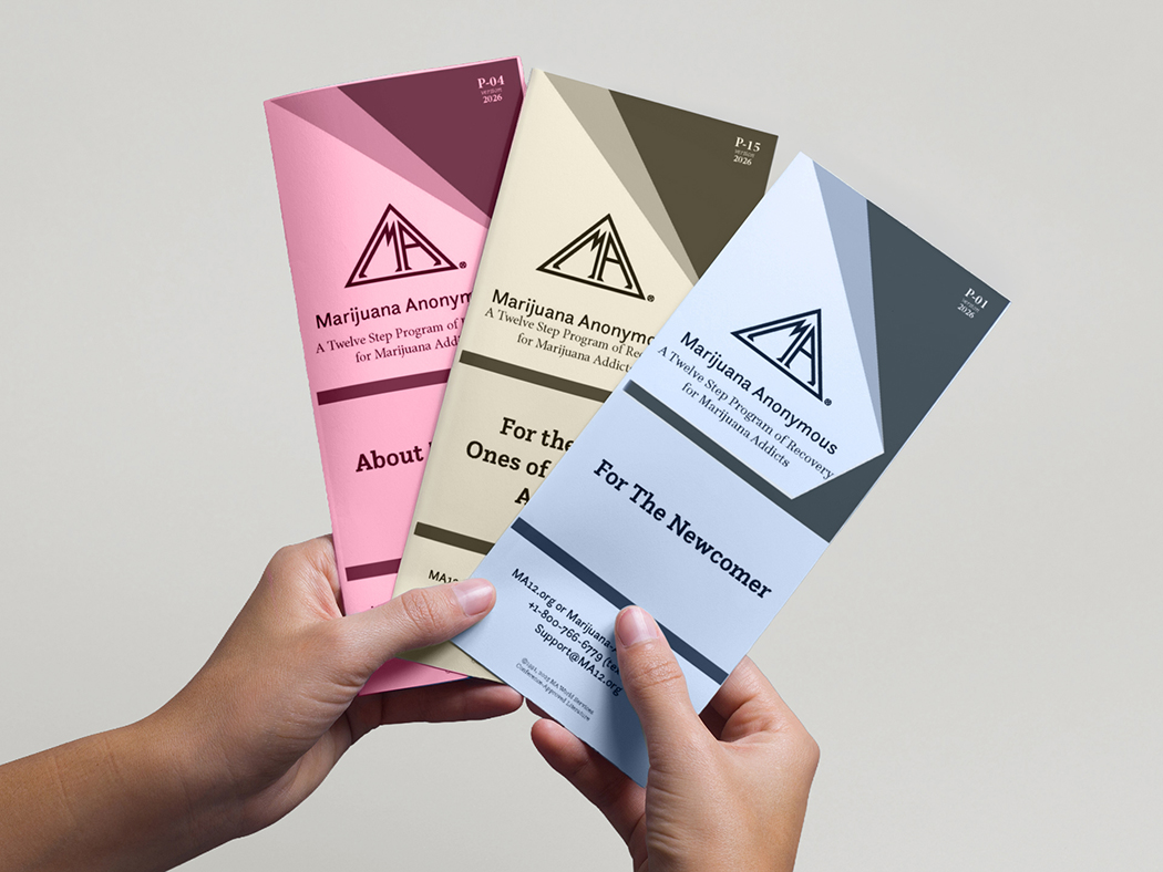 Hand holding three Marijuana Anonymous recovery pamphlets covering sponsorship, the Twelve Steps, and recovery.